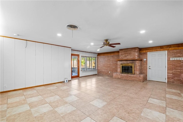 unfurnished living room with ceiling fan, a brick fireplace, visible vents, and recessed lighting
