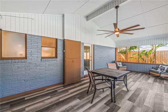 wooden deck featuring outdoor dining space, ceiling fan, and fence