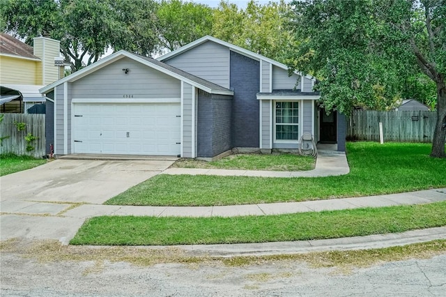 6906 Whalen Dr, Corpus Christi, TX 78413 - mid-century modern home with an attached garage, driveway, and brick siding