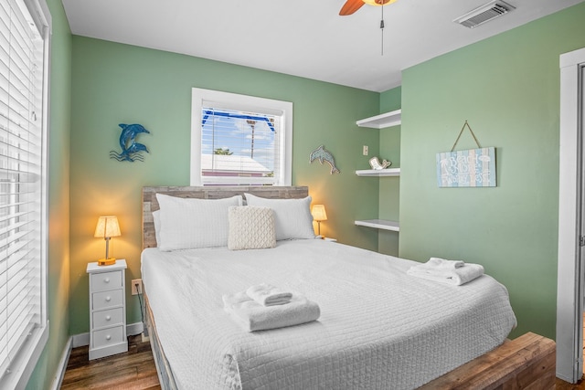 bedroom featuring dark hardwood / wood-style flooring and ceiling fan