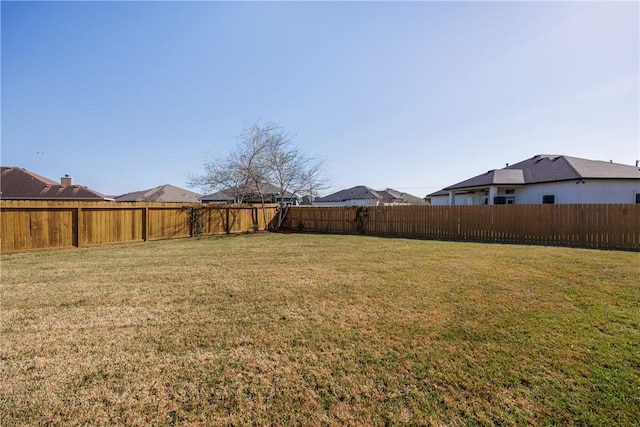 view of yard featuring a fenced backyard