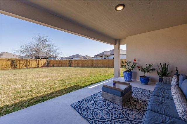 view of patio featuring an outdoor hangout area and a fenced backyard