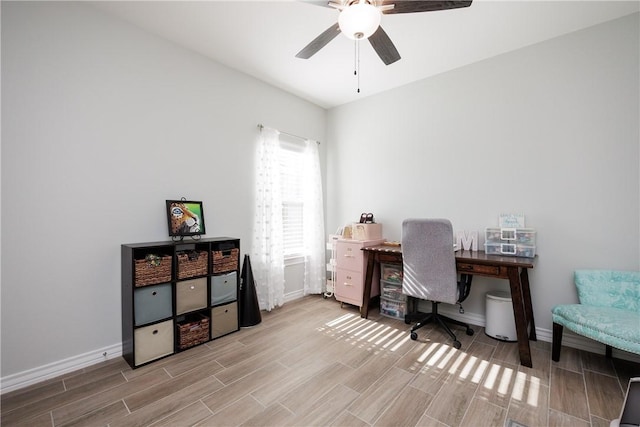 office featuring baseboards, a ceiling fan, and wood tiled floor