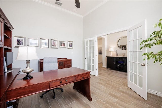 office featuring visible vents, a ceiling fan, wood tiled floor, crown molding, and french doors