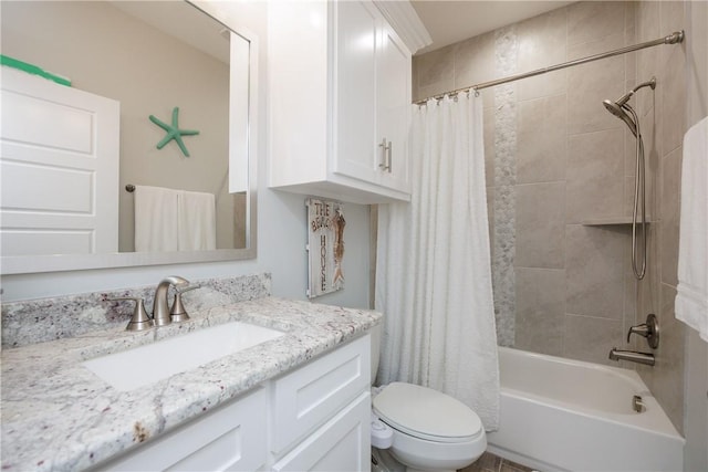 bathroom with toilet, shower / bath combination with curtain, and vanity