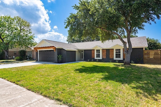 ranch-style house featuring an attached garage, brick siding, fence, concrete driveway, and a front yard