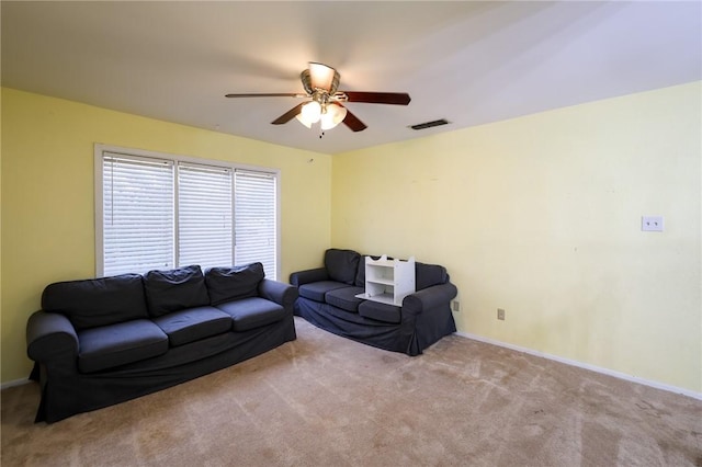 living room featuring ceiling fan and light carpet