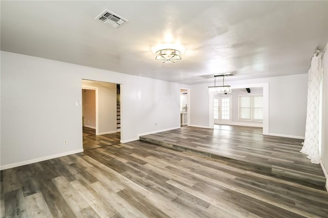 unfurnished room featuring dark wood-type flooring