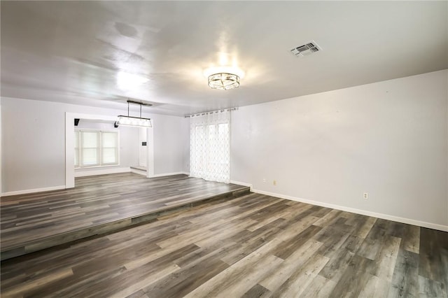 unfurnished room featuring dark hardwood / wood-style floors