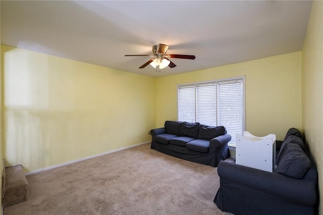 carpeted living room featuring ceiling fan