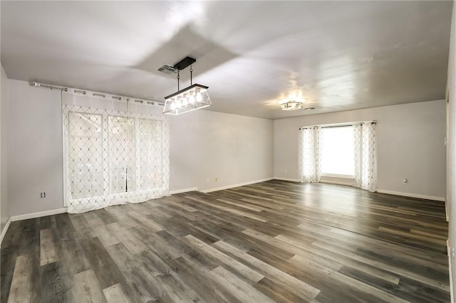 spare room featuring dark hardwood / wood-style floors