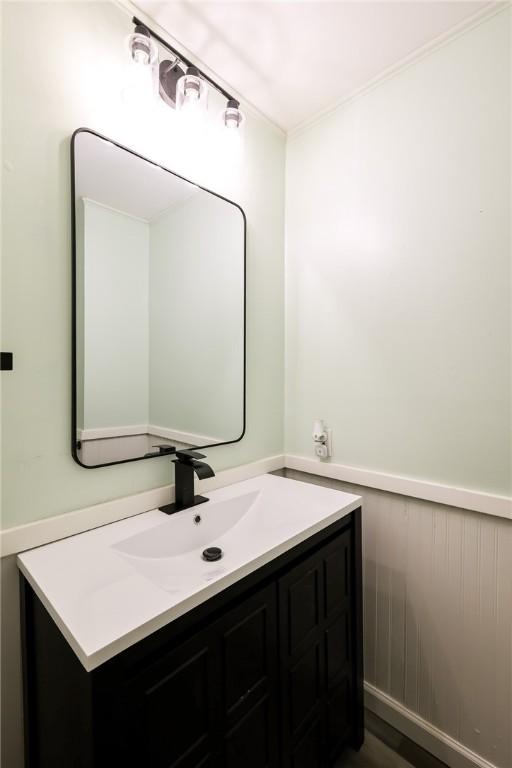 bathroom with hardwood / wood-style floors and vanity