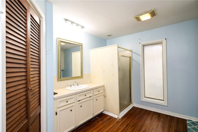 bathroom with vanity and walk in shower