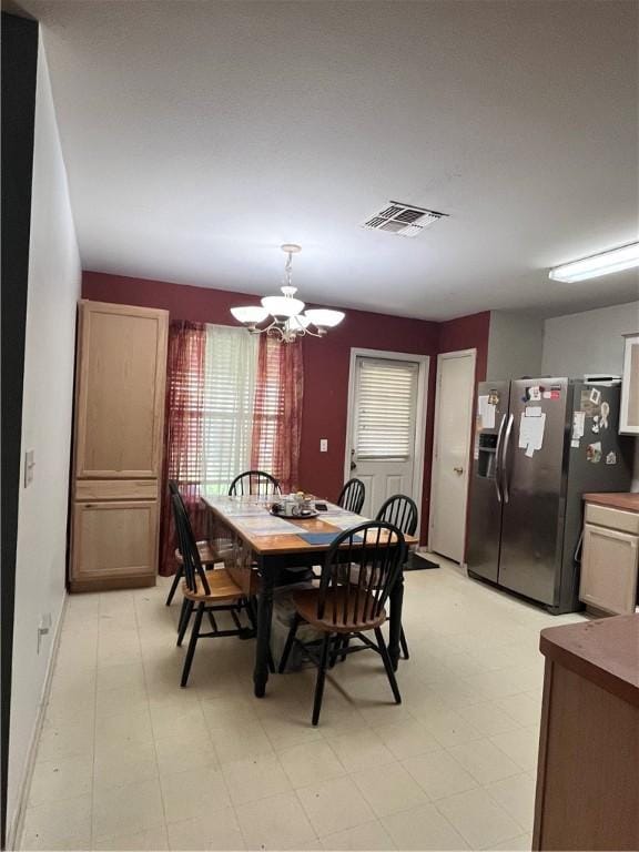 3101 Saskatchewan Dr, Corpus Christi, TX 78414 - dining area featuring a chandelier and light floors