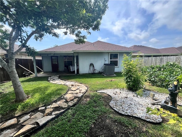 3101 Saskatchewan Dr, Corpus Christi, TX 78414 - back of house featuring a fenced backyard, a patio area, and a shingled roof