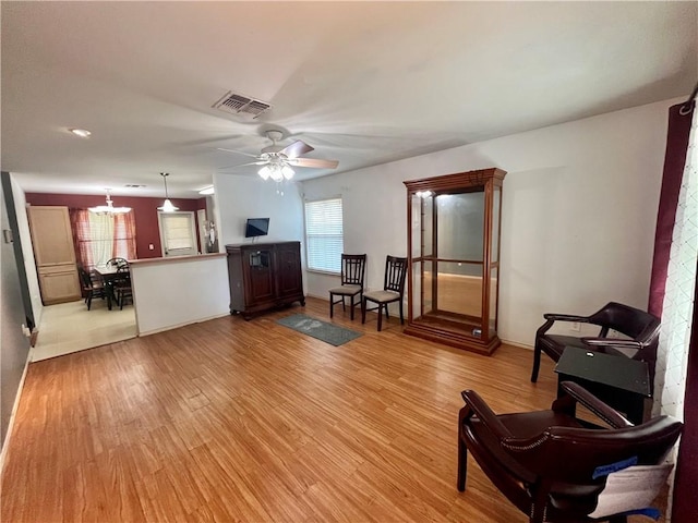 3101 Saskatchewan Dr, Corpus Christi, TX 78414 - living room featuring light wood-style flooring, healthy amount of natural light, and ceiling fan