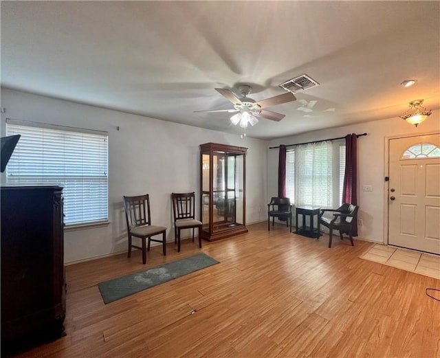 3101 Saskatchewan Dr, Corpus Christi, TX 78414 - foyer entrance featuring plenty of natural light, light wood finished floors, and a ceiling fan