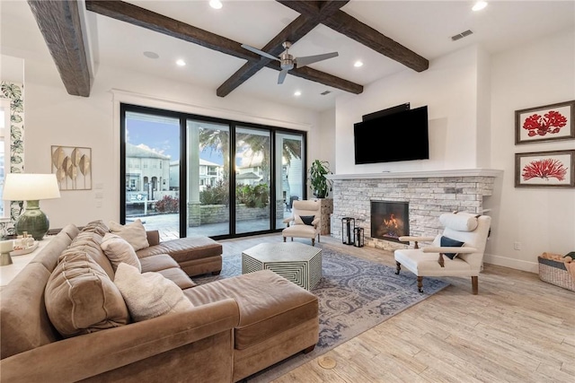 living area with wood finished floors, visible vents, baseboards, beam ceiling, and recessed lighting