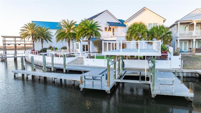 dock area featuring a water view and boat lift