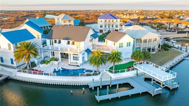 birds eye view of property featuring a residential view and a water view