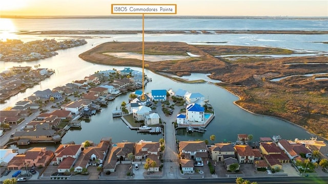 birds eye view of property featuring a residential view and a water view