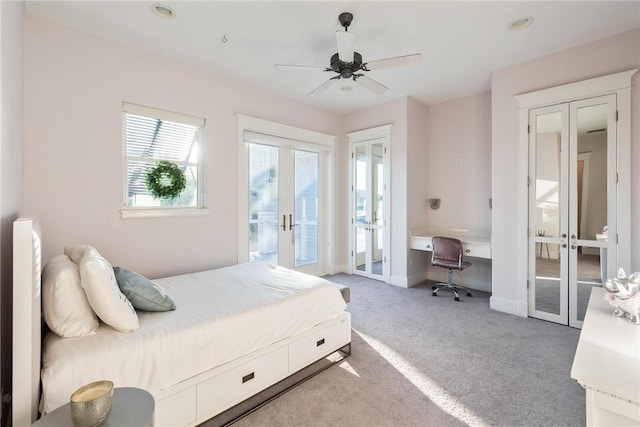 carpeted bedroom with french doors, baseboards, ceiling fan, and access to outside