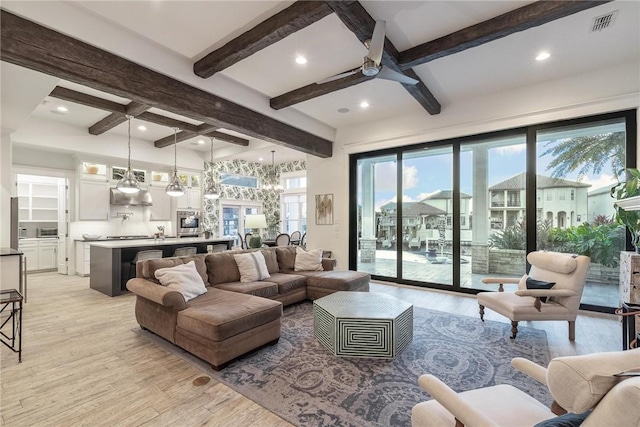 living area featuring visible vents, beam ceiling, recessed lighting, ceiling fan, and light wood-style floors