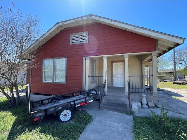 view of front of property with covered porch and stucco siding