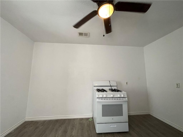 kitchen with visible vents, wood finished floors, a ceiling fan, and white gas range oven