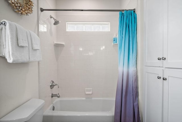 full bath featuring shower / tub combo with curtain and toilet