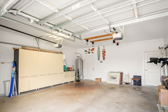 garage featuring electric water heater and a garage door opener