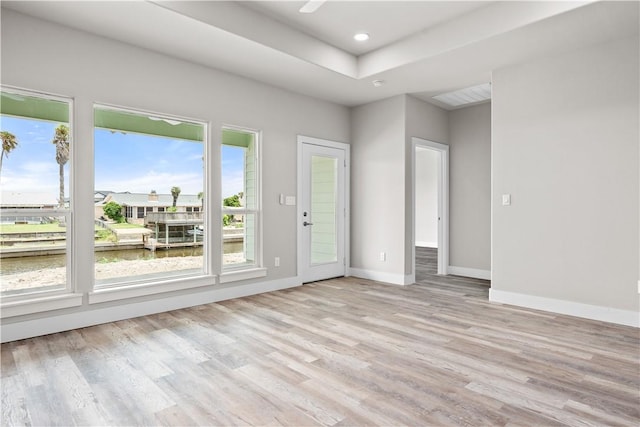 15501 Cruiser St Unit A, Corpus Christi, TX 78418 - unfurnished room featuring light wood-style floors, a raised ceiling, and recessed lighting