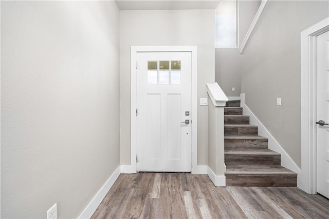 15501 Cruiser St Unit A, Corpus Christi, TX 78418 - foyer entrance featuring stairs and wood finished floors