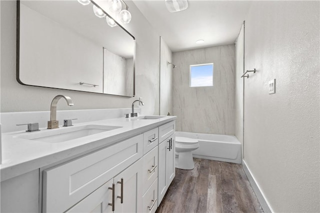 15501 Cruiser St Unit A, Corpus Christi, TX 78418 - full bathroom featuring double vanity, wood finished floors, and washtub / shower combination
