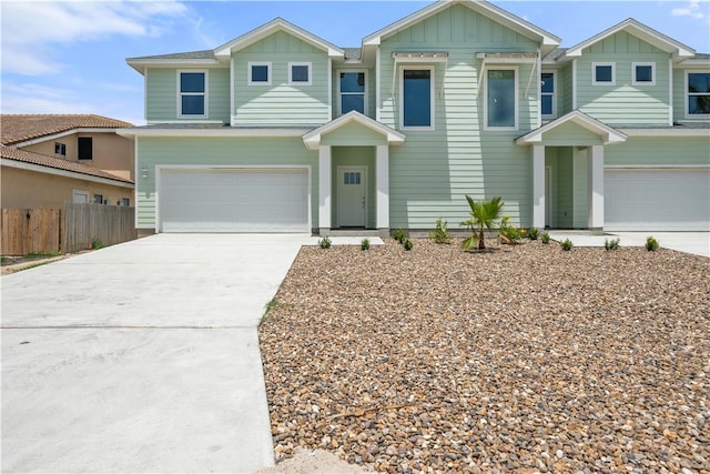 15501 Cruiser St Unit A, Corpus Christi, TX 78418 - view of front of home with board and batten siding, an attached garage, and driveway