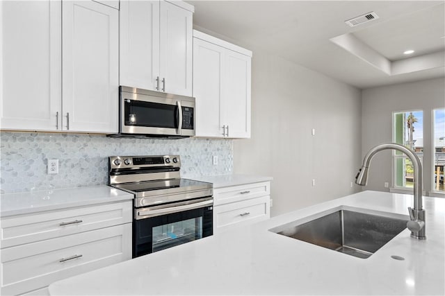15501 Cruiser St Unit A, Corpus Christi, TX 78418 - kitchen with appliances with stainless steel finishes, light countertops, and backsplash