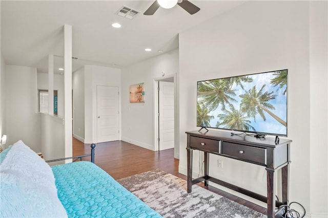 bedroom with ceiling fan and dark hardwood / wood-style flooring