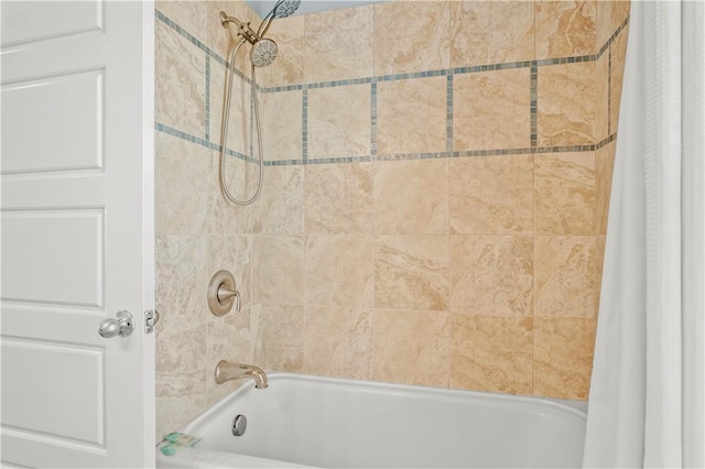 bathroom with shower / bath combo