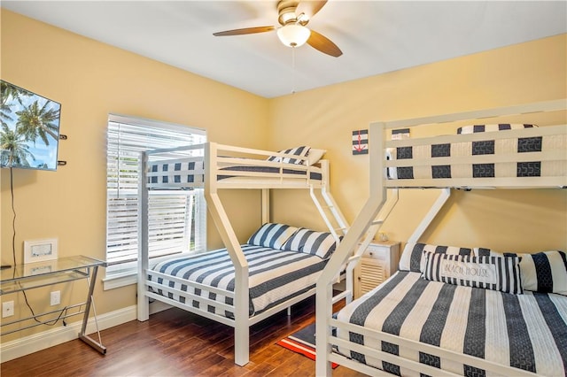 bedroom with ceiling fan and dark hardwood / wood-style floors