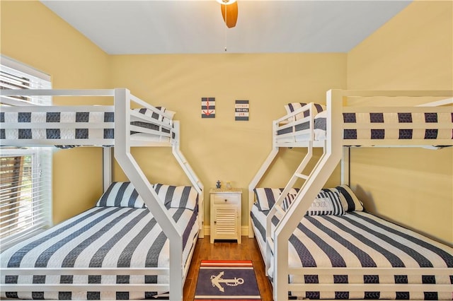 bedroom with dark wood-type flooring