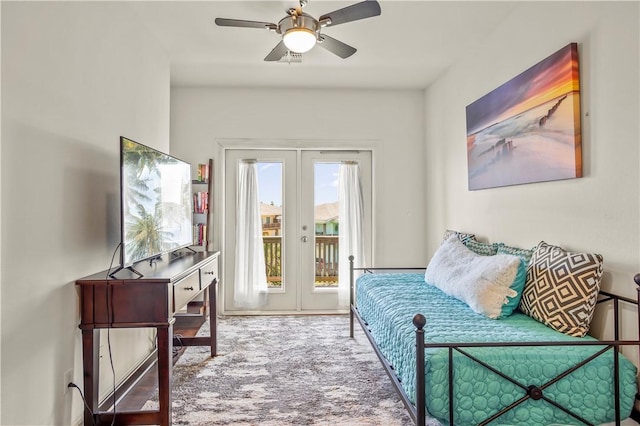 sitting room featuring carpet floors, ceiling fan, and french doors