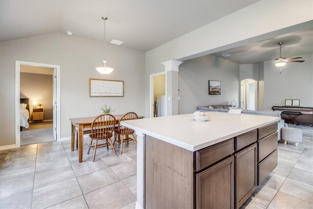 6753 Mikayla St, Corpus Christi, TX 78413 - kitchen with lofted ceiling, open floor plan, arched walkways, ceiling fan, and a kitchen island