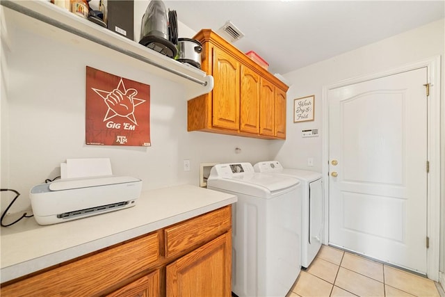 3226 Bordeaux Dr, Corpus Christi, TX 78414 - laundry room featuring cabinet space, light tile patterned floors, and washer and dryer