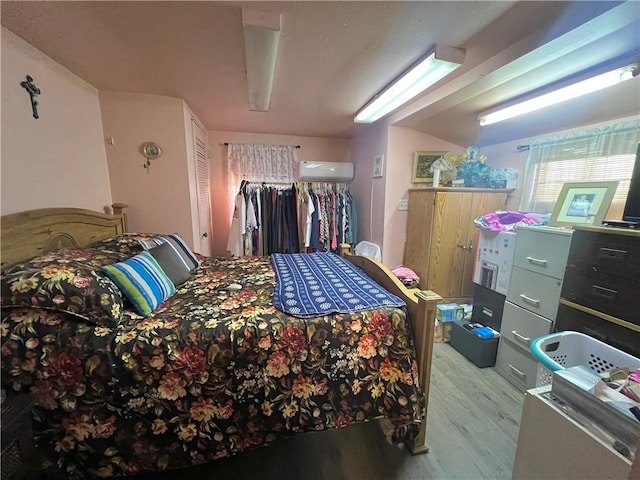 bedroom featuring light hardwood / wood-style floors and a closet