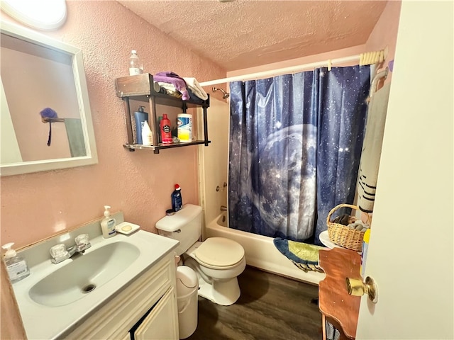 full bathroom featuring toilet, a textured ceiling, vanity, shower / bath combo, and hardwood / wood-style floors