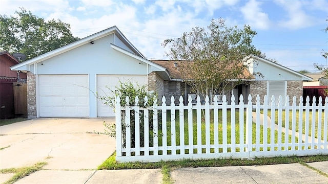 single story home featuring a front yard and a garage