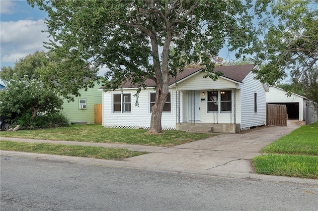 4429 Moravian Dr, Corpus Christi, TX 78411 - view of front of property featuring an outbuilding, a porch, a front lawn, and driveway