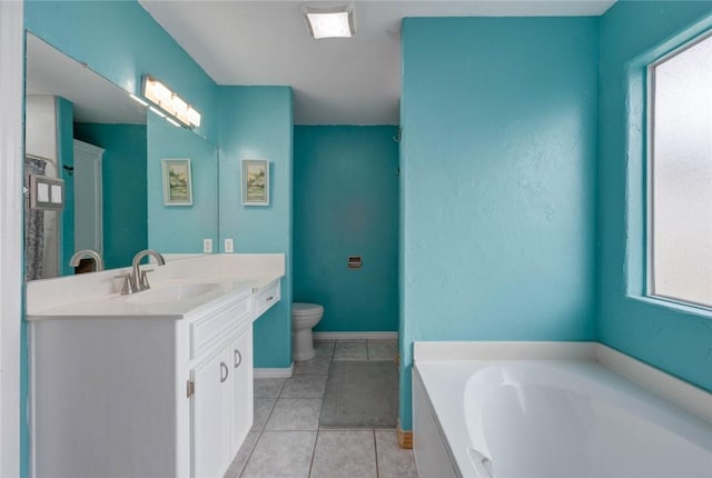 7313 Prairie Dr, Corpus Christi, TX 78413 - bathroom featuring vanity, a garden tub, healthy amount of natural light, and tile patterned flooring