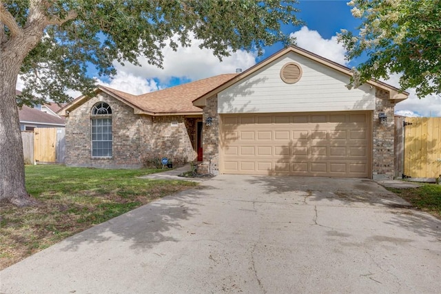 7313 Prairie Dr, Corpus Christi, TX 78413 - ranch-style house featuring an attached garage, brick siding, and driveway