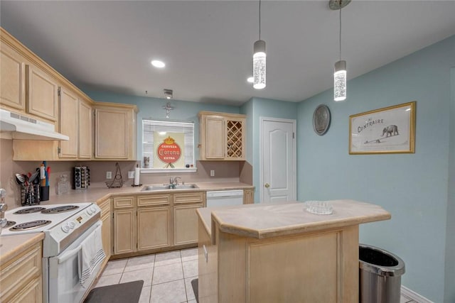 7313 Prairie Dr, Corpus Christi, TX 78413 - kitchen with white appliances, under cabinet range hood, and light brown cabinets